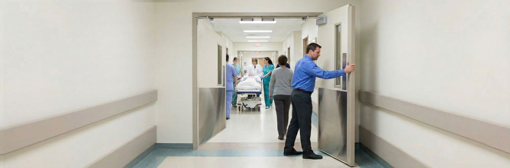 Double doors opening both ways in a corridor