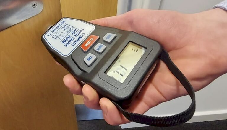 Ensuring compliance in door opening forces
